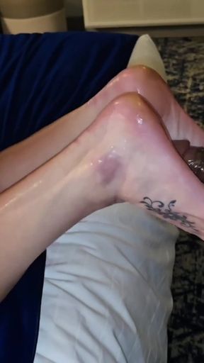 Oiled up Blonde MILF Gives First Foot Job