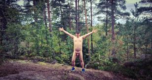Naked hiker in woods