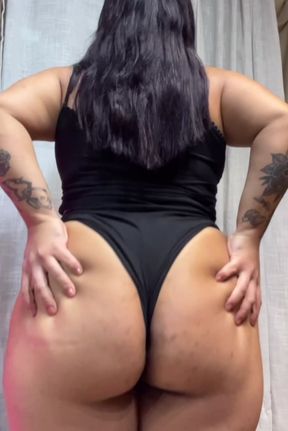 Plus Size Woman in Black Swimsuit