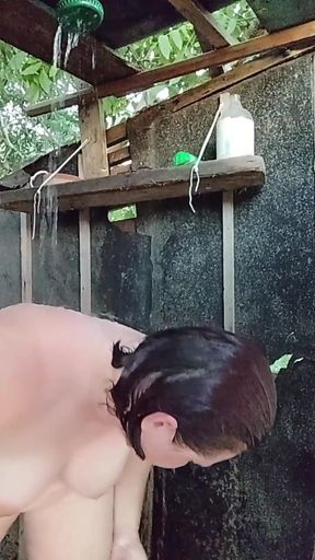 I'm watching a curvy girl wash herself in the street.   Clip 1
