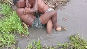 Mud wrestling between two men with lots of kicking punching headlocks body scissors