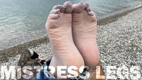 Sexy feet in gray nylon socks with separate toes teasing at the seashore (MP4 HD)