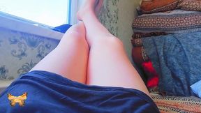Lovely femboy laying on couch with legs crossed