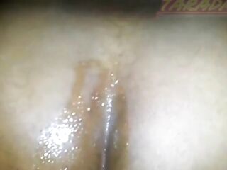 Ebony woman sitting with her tail