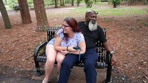 Hot MILF strokes and sucks big black cock in the park