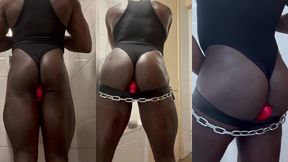 singlet attired black muscle butt chained & plugged