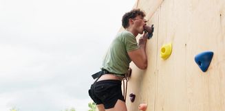 Curly bloke gets blacked by his climbing trainer