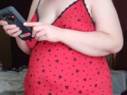 being Mrs Kitty and playing with my boobs.