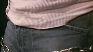 MuscleJockBound.com - Bound by chains, tattooed man in uniform endures rough and erotic domination