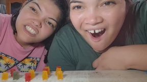 Hungry Giants eat gummy bears between the two of them