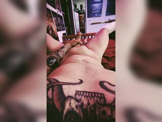 Tattooed Chap Masturbating in Daybed with SloMo Spunk fountain