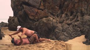 Men Wrestling On The Beach