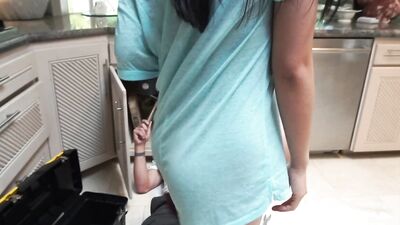 Exotic hottie sucks her hung plumber off before being banged in the kitchen