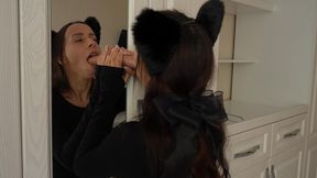 catgirl sucks dildo on the mirror