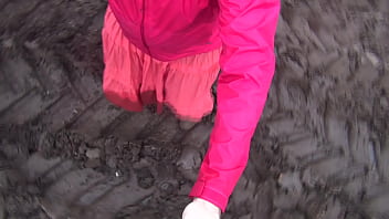 Brokenbitch filling the soles of her rubberboots with mud