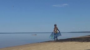 my wife is on the beach in a yellow bikini