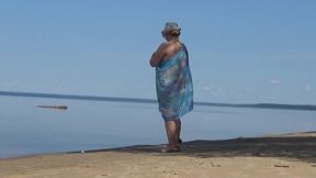 my wife is on the beach in a yellow bikini