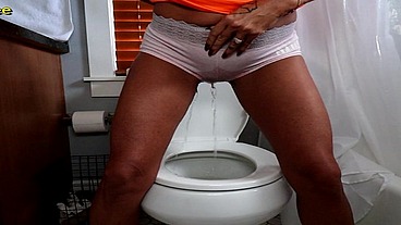 MILF Brandon Areana wetting her panties over toilet