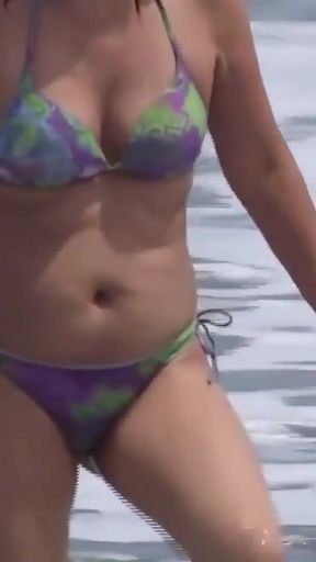At the beach, my beautiful stepmother shows me her tits and her big, hairy pussy.   Clip 1