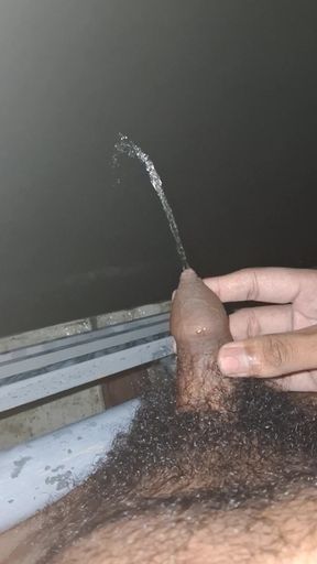 Hot man urinating from top floor