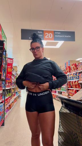 Athletic cutie flashes her goods at the supermarket
