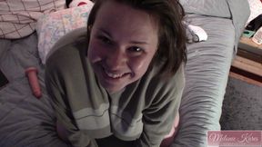 Playing with body massager in bed