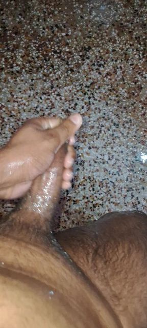 A Young Hindu Boy From India Is Fucking His Thick Cock Hard with His Hands While Taking a Bath