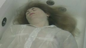 You are face up in bathtub where you try to go underwater and release a little air WMV FULL HD 1080p