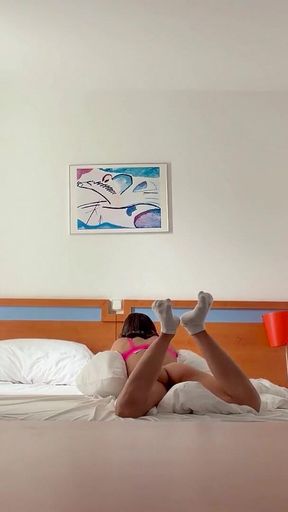 Woman Being Recorded in Hotel Room