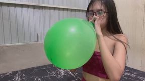 Blow to pop big balloon with Savannah