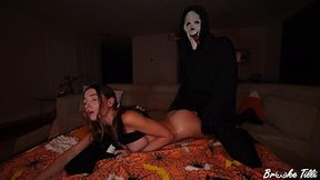 Guy in a Scream mask is fucking a girl's pussy while her bf's busy on Halloween