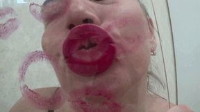 Red kissing sexy puffy lips on glass l