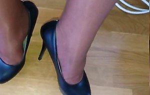Crossdresser in layered shiny pantyhose and stockings