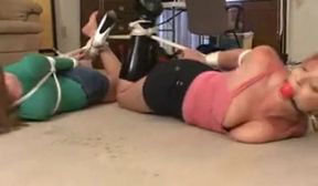 two women playing bondage games