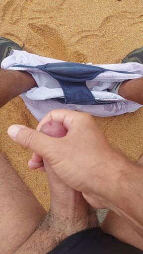 Ladysilva masturbating his cock on a deserted beach until he cums hot