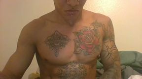 Guy with Some Crazy Piercings and Tatoos