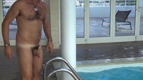 Four men at swimming pool