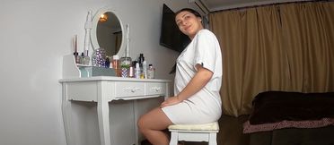Brunette solo in hotel room