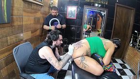 Tattooed MILF vlogs herself getting a tattoo on her ass