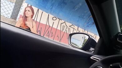 Risky masturbation for a redhead at a public bus stop!