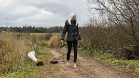 A girl in strappy shoes goes for a walk in rainy weather, there are puddles everywhere and mud that covers her shoes and feet