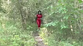 Pretty girl tied up, ballgagged, and suspended in a catsuit