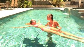 Hot babes tease each other in the swimming pool until they carry it on to the living room