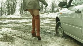 Russian girl in pantyhose high heels boots stuck in the mud