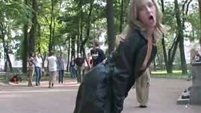 Gorgeous long legged blonde teen in the park shows her breasts