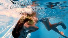 Big boobs blonde babe swimming