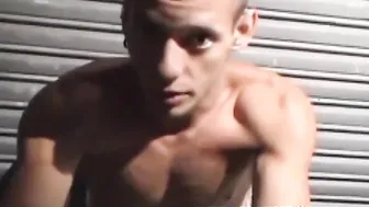 Inked jock handcuffed and jerking his hard cock solo