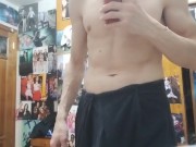 Young guy getting dressed after shower