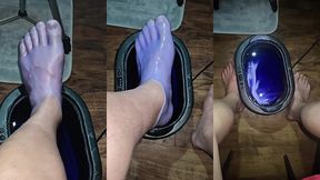 pov dipping foot in paraffin view