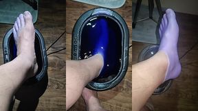 pov dipping foot in paraffin view